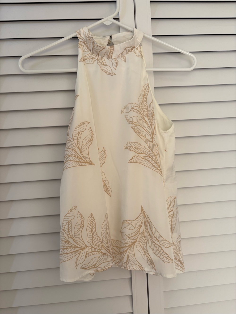 Chic Ivory Halter Neck Blouse with Gold Tropical Leaf Print